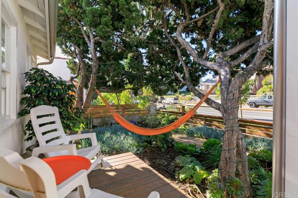 721 3rd Street Encinitas, CA 92024 - Photo 3 of 36 a view of a chairs and table in a backyard