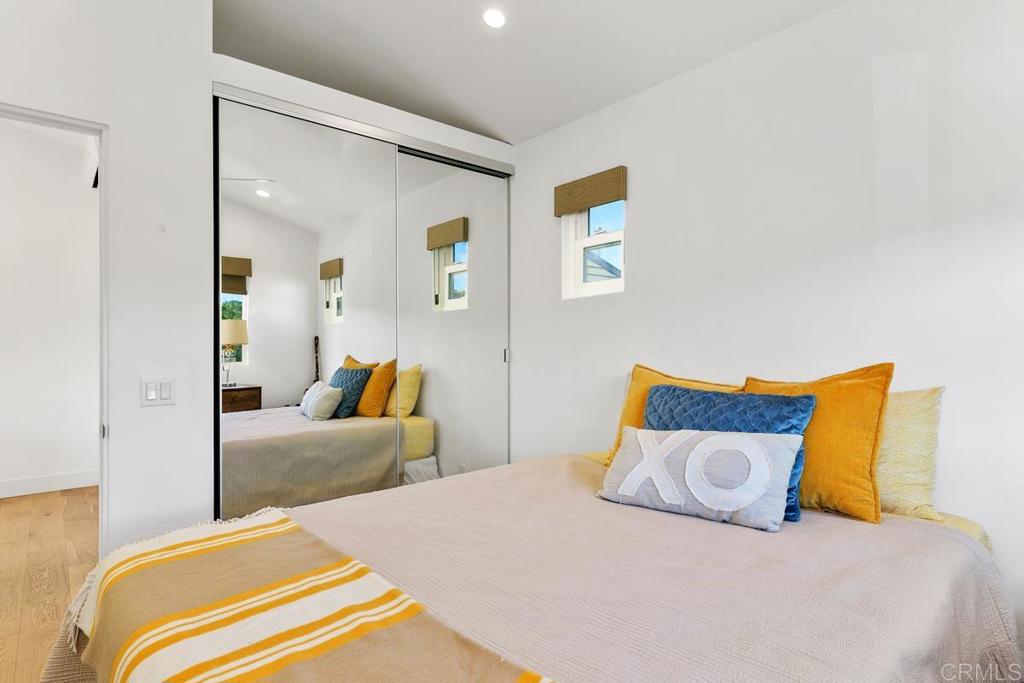 721 3rd Street Encinitas, CA 92024 - Photo 32 of 36 a bedroom with a bed and couch