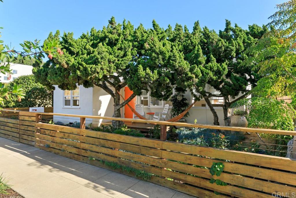 721 3rd Street Encinitas, CA 92024 - Photo 34 of 36 a front view of a house with a tree