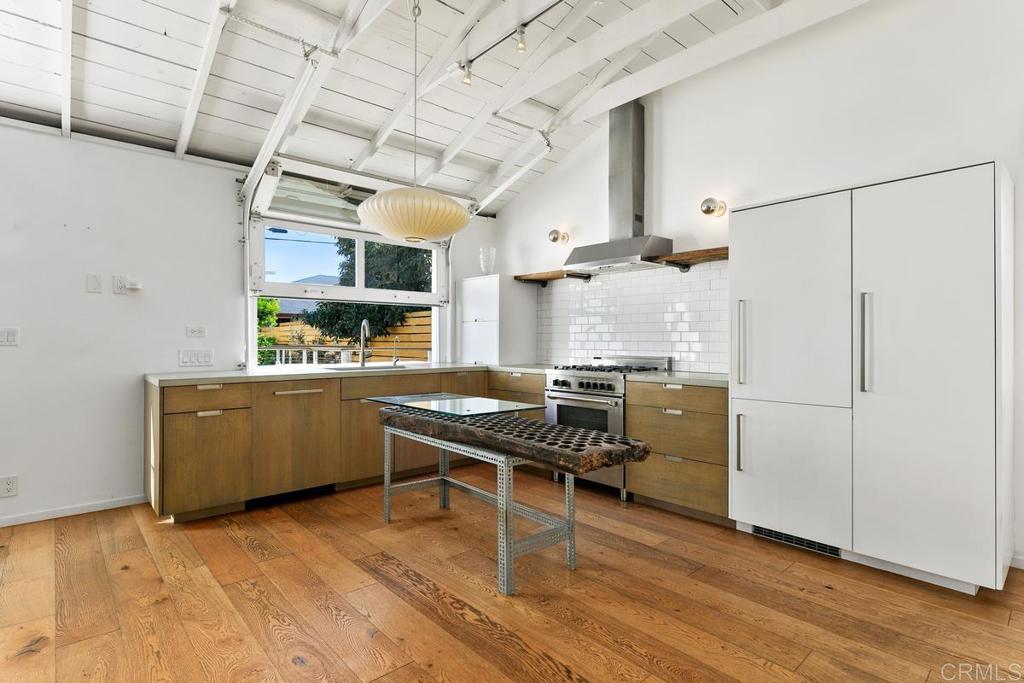 721 3rd Street Encinitas, CA 92024 - Photo 5 of 36 a kitchen with cabinets and wooden floor