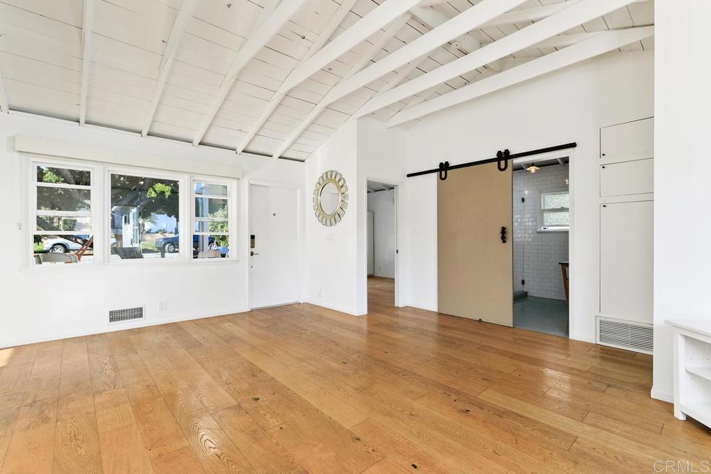 721 3rd Street Encinitas, CA 92024 - Photo 6 of 36 a view of an empty room with wooden floor