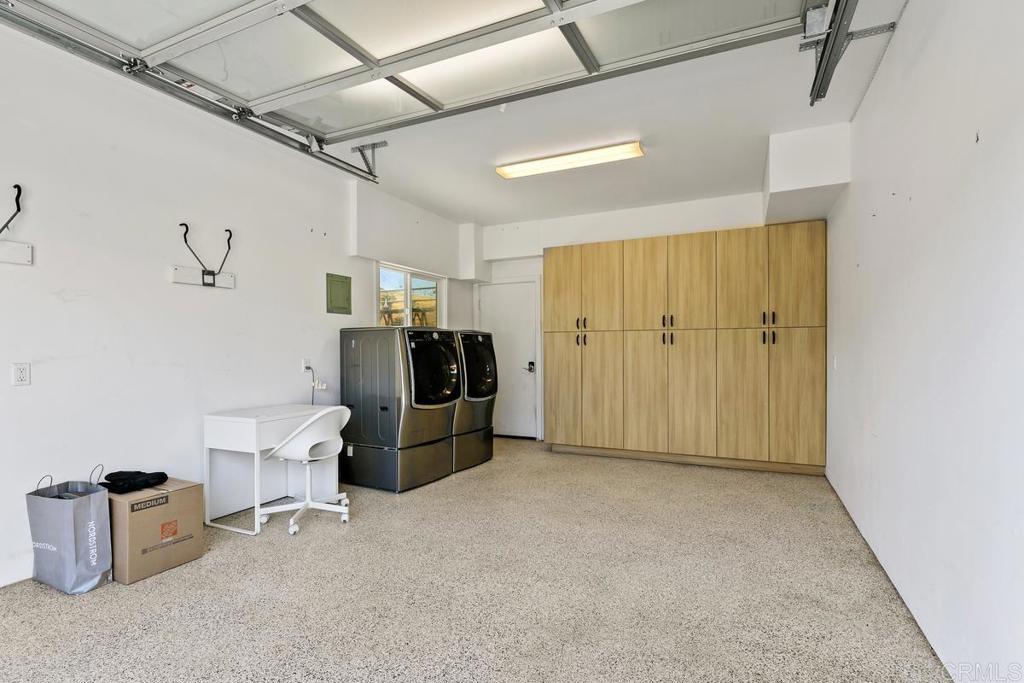 721 3rd Street Encinitas, CA 92024 - Photo 7 of 36 a view of a storage & utility room with two washing machine