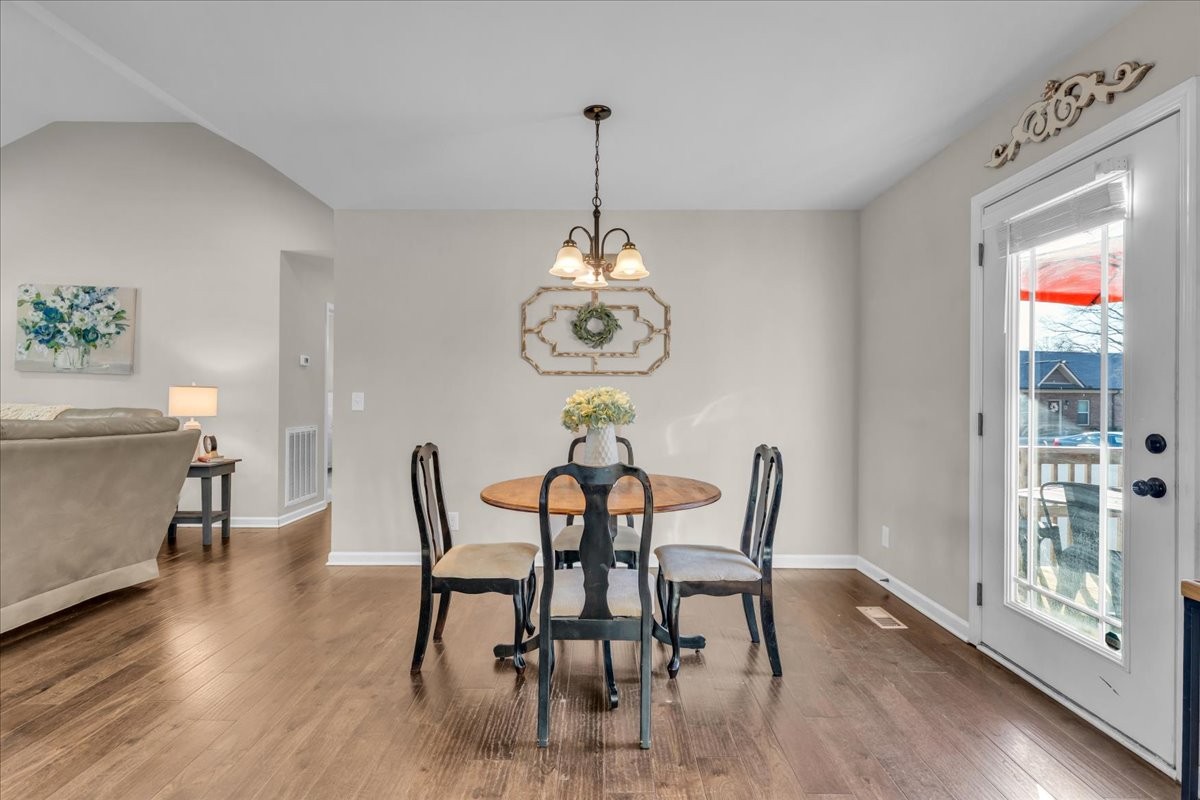 1554 South Spring Street Manchester, TN 37355 - Photo 19 of 33 a view of a dining room with furniture window and wooden floor