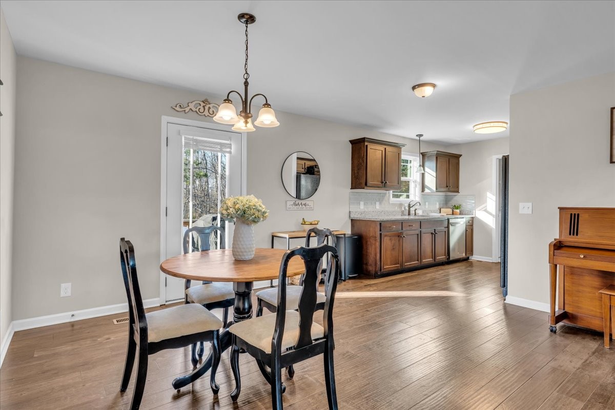 1554 South Spring Street Manchester, TN 37355 - Photo 20 of 33 a view of a dining room with furniture and wooden floor