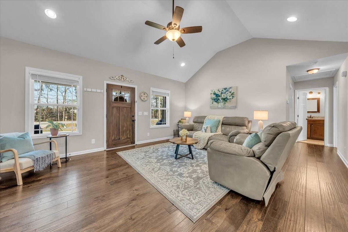 1554 South Spring Street Manchester, TN 37355 - Photo 9 of 33 a living room with furniture and a chandelier