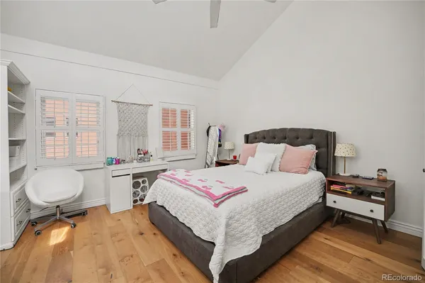 a bedroom with a bed and a couch