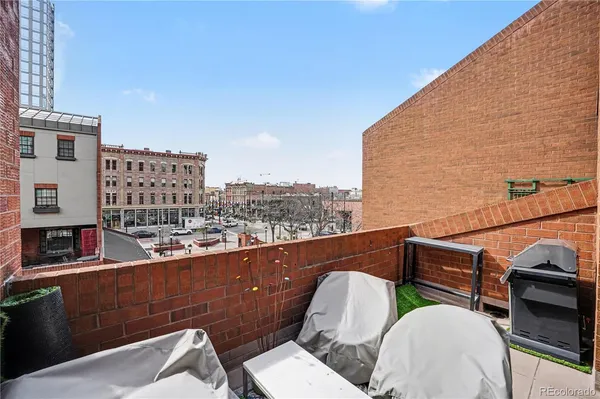 a view of a balcony with chairs