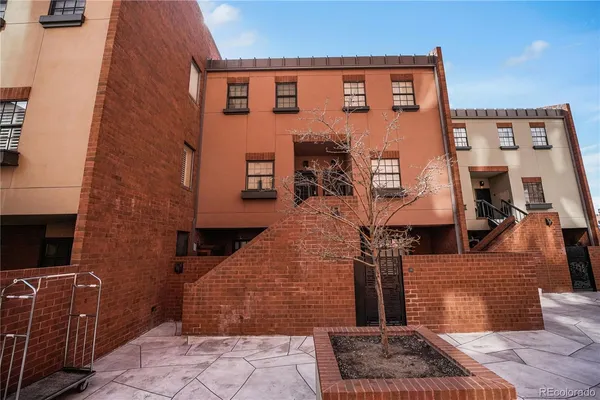 a front view of a building with many windows