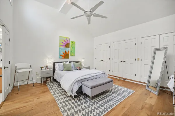 a spacious bedroom with a bed and a table