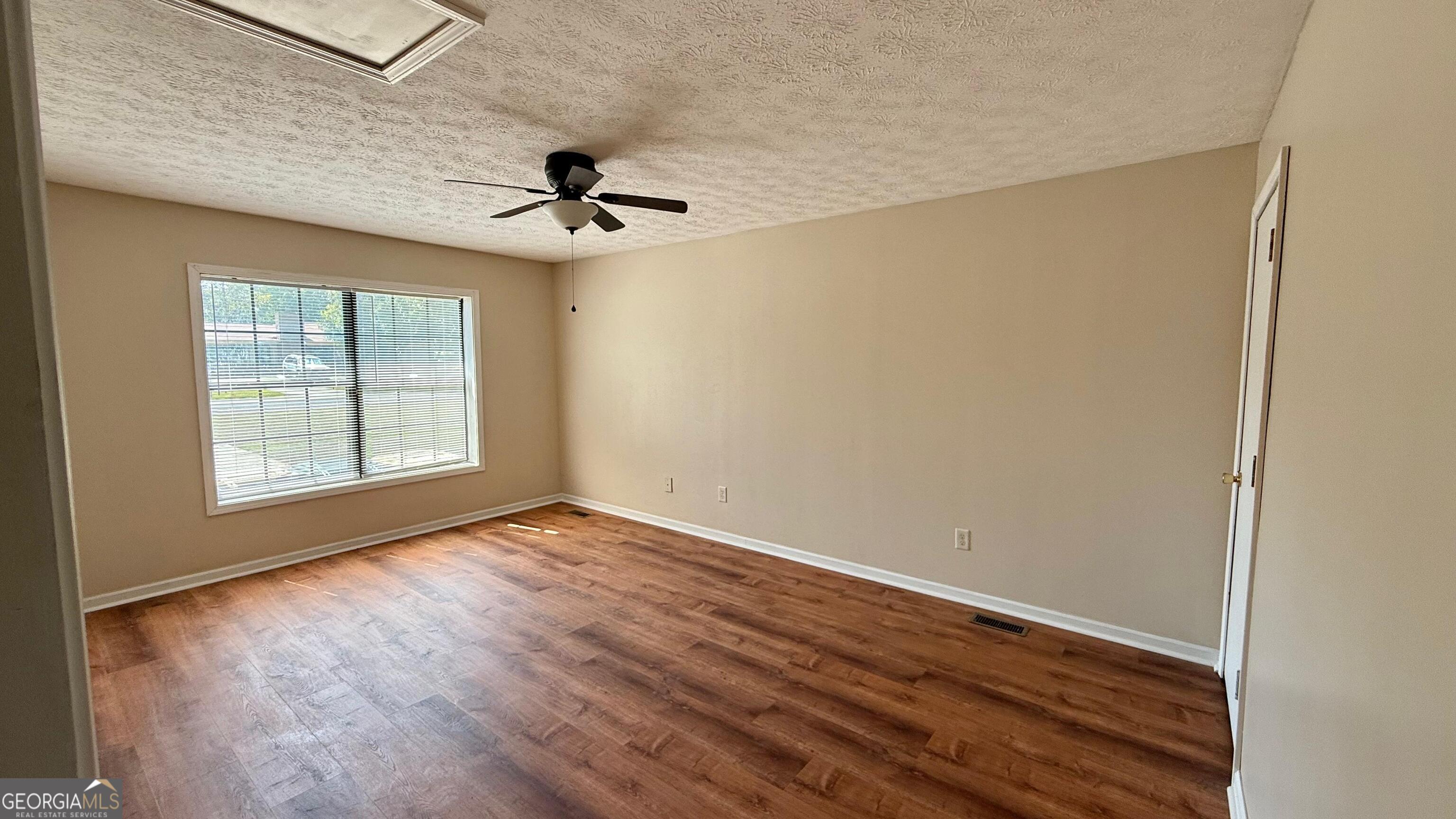 233 Longmeadow Drive Northwest Rome, GA 30165 - Photo 12 of 19 an empty room with windows and fan