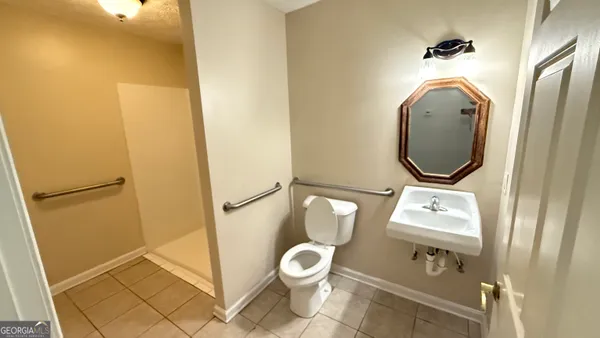 a bathroom with a toilet and a sink