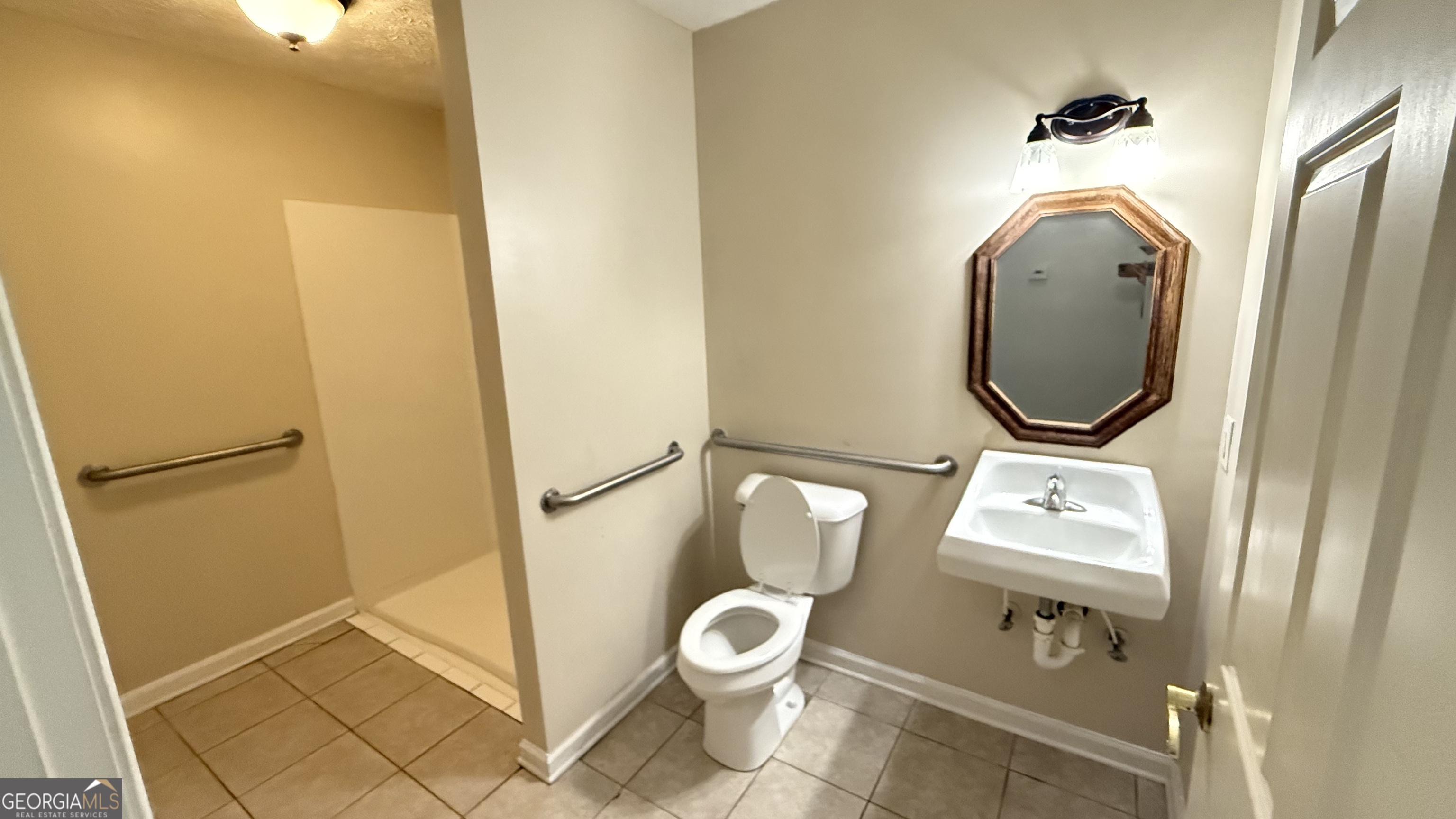 233 Longmeadow Drive Northwest Rome, GA 30165 - Photo 13 of 19 a bathroom with a toilet and a sink
