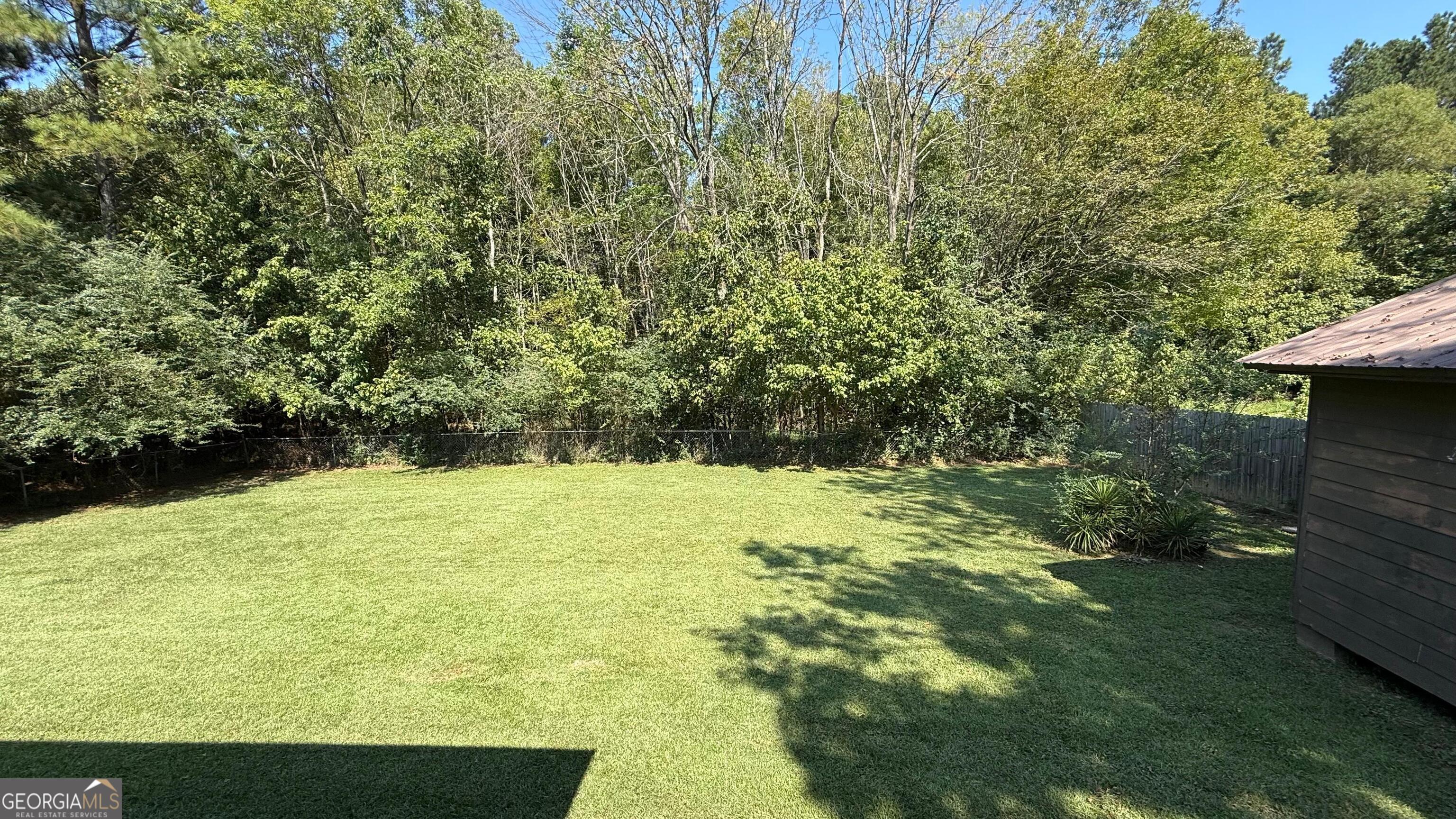233 Longmeadow Drive Northwest Rome, GA 30165 - Photo 17 of 19 a view of a yard with an outdoor seating