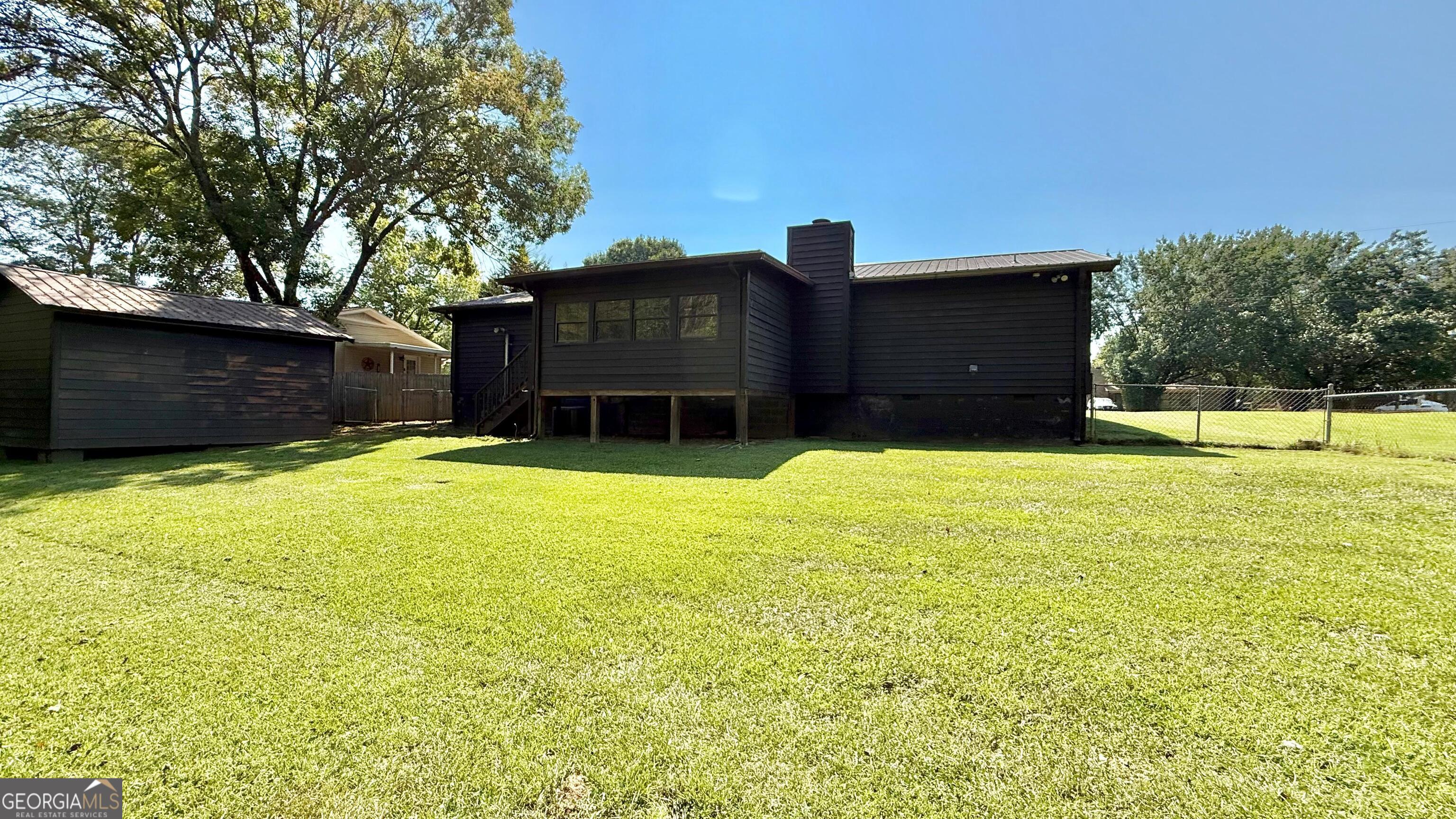 233 Longmeadow Drive Northwest Rome, GA 30165 - Photo 18 of 19 a house view with a outdoor space