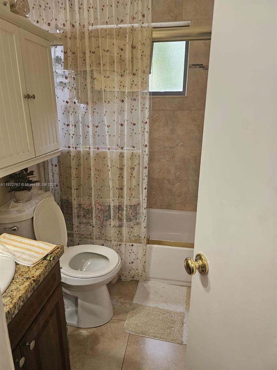 1521 West 42nd Place, Unit 18 Hialeah, FL 33012 - Photo 7 of 14 a bathroom with a sink and a toilet