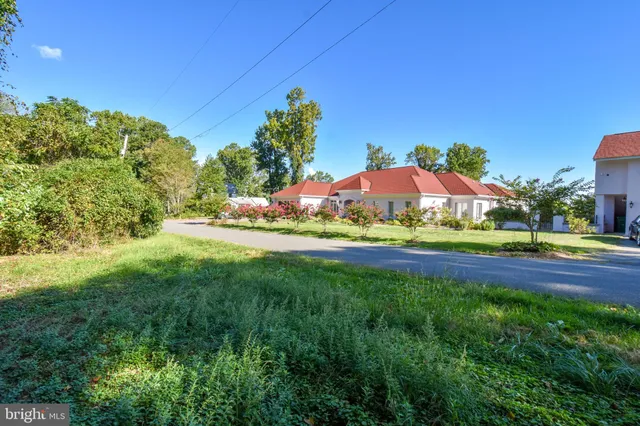 a view of swimming pool with outdoor seating and yard
