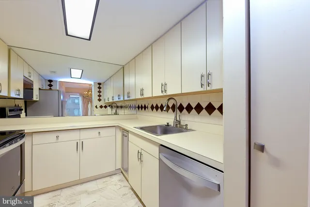 a kitchen with a sink and cabinets