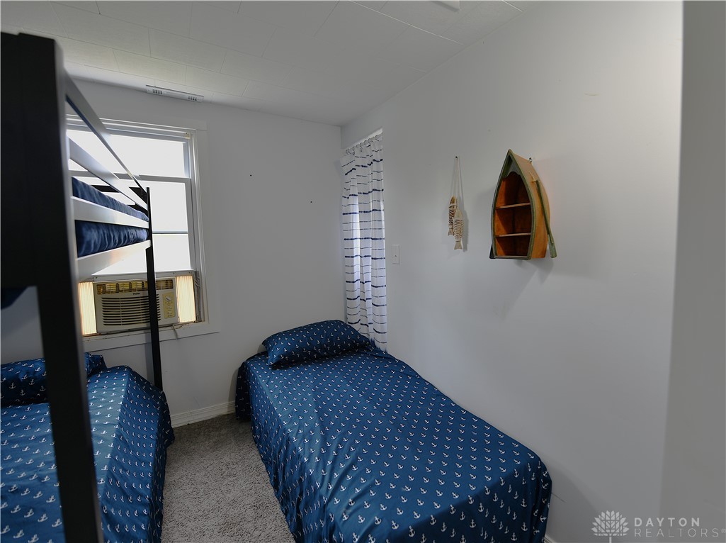 5445 Behm Road, Unit 15 Celina, OH 45822 - Photo 9 of 49 This cozy bedroom offers practical sleeping arrangements for optimal space utilization.