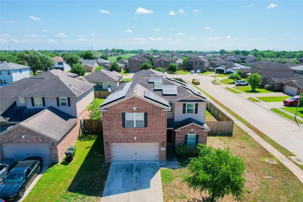 an aerial view of a house with a garden