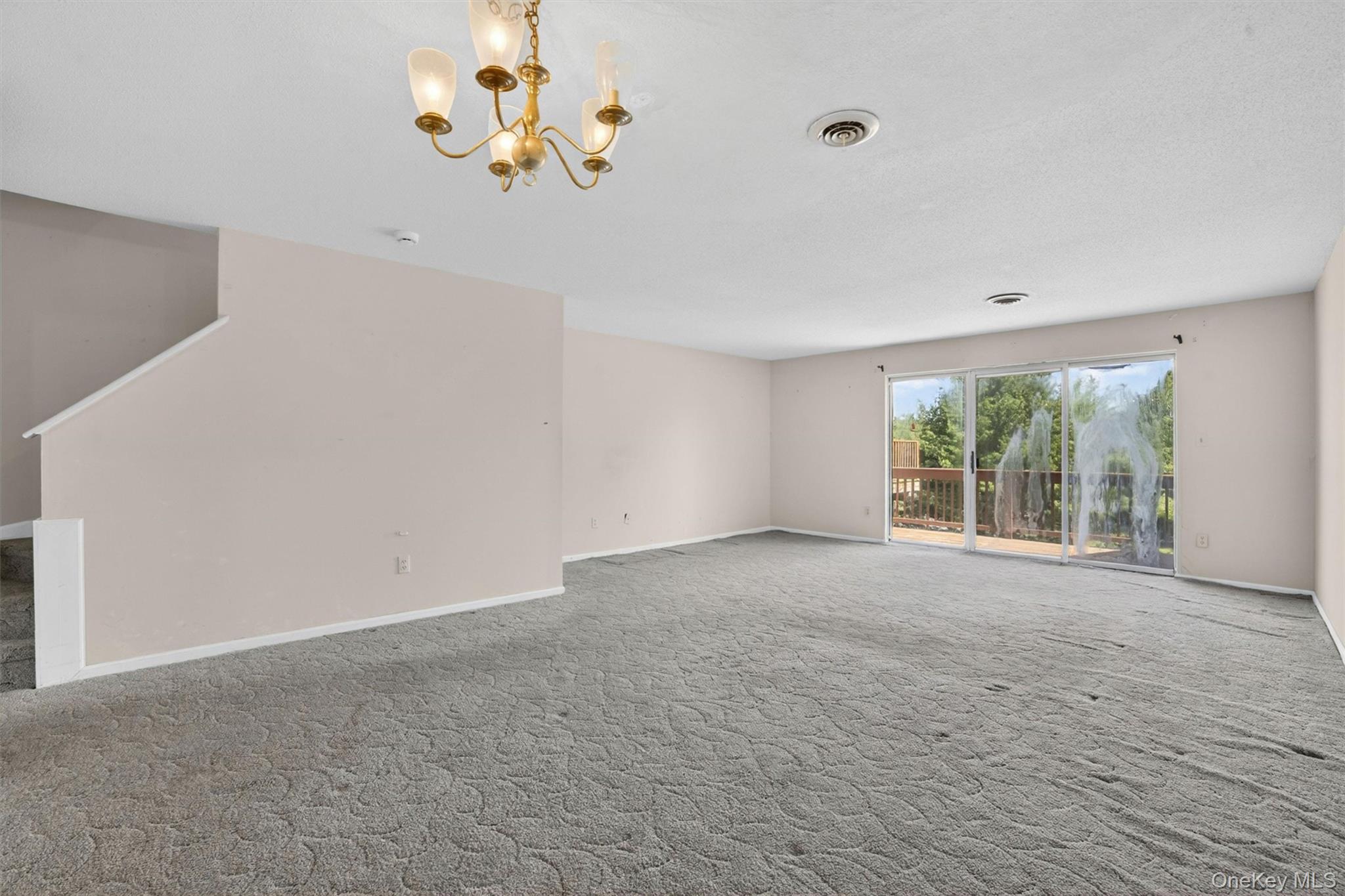 116 Fields Lane Peekskill, NY 10566 - Photo 10 of 40 a view of an empty room with a window