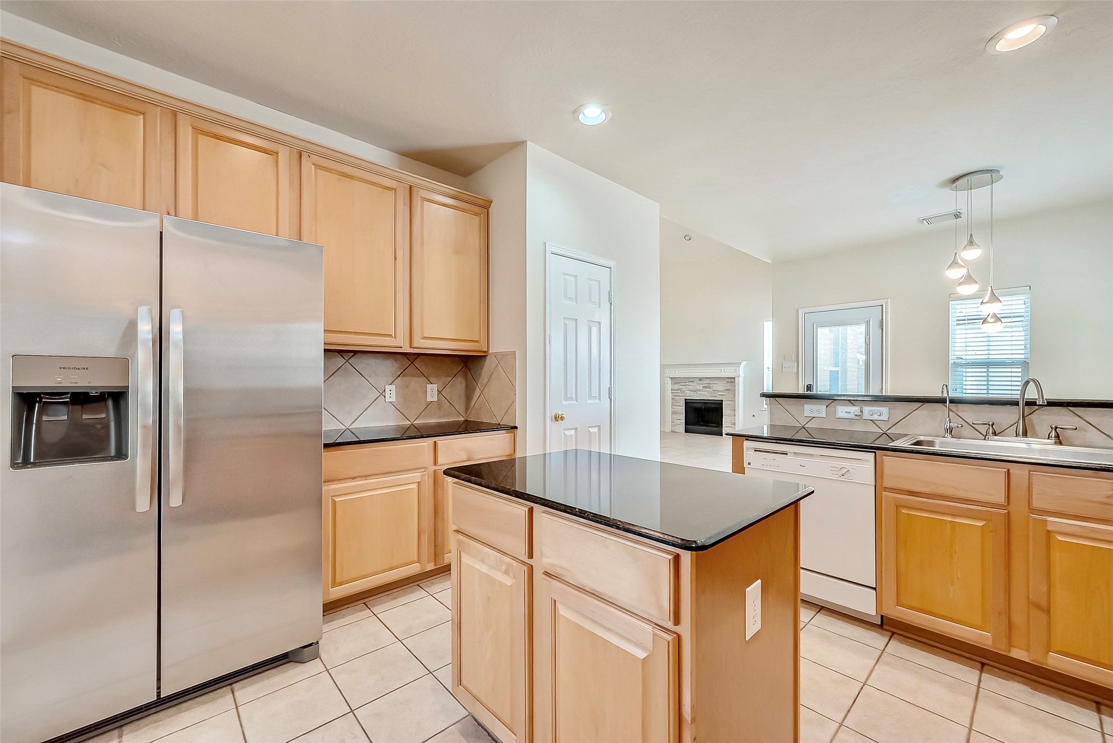 5506 Flower Grove Court Rosharon, TX 77583 - Photo 11 of 30 Kitchen view of all the cabinets and island space available