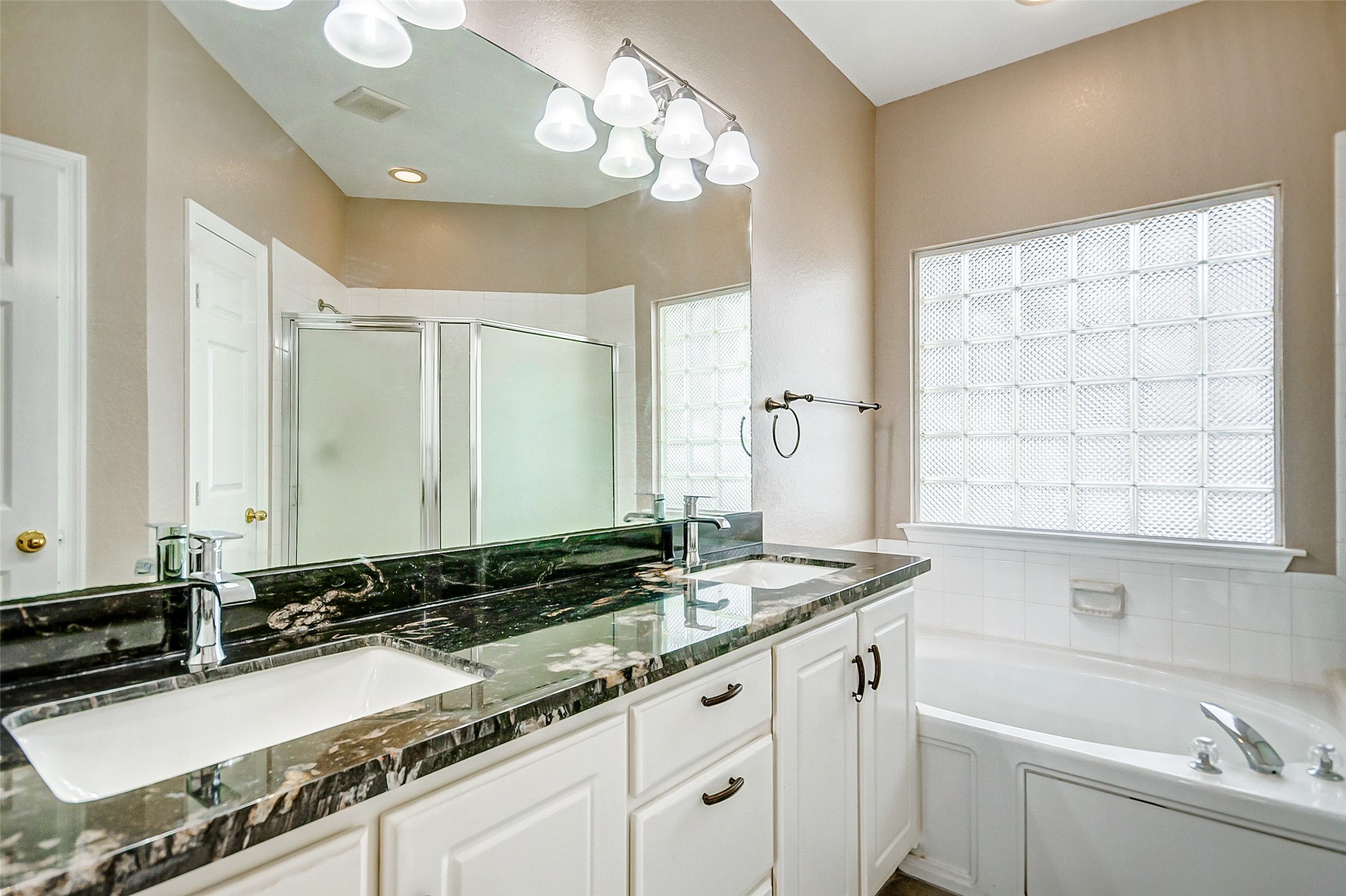 2022 Ridge Wood Lane Sugar Land, TX 77479 - Photo 11 of 21 a bathroom with a granite countertop sink and a mirror