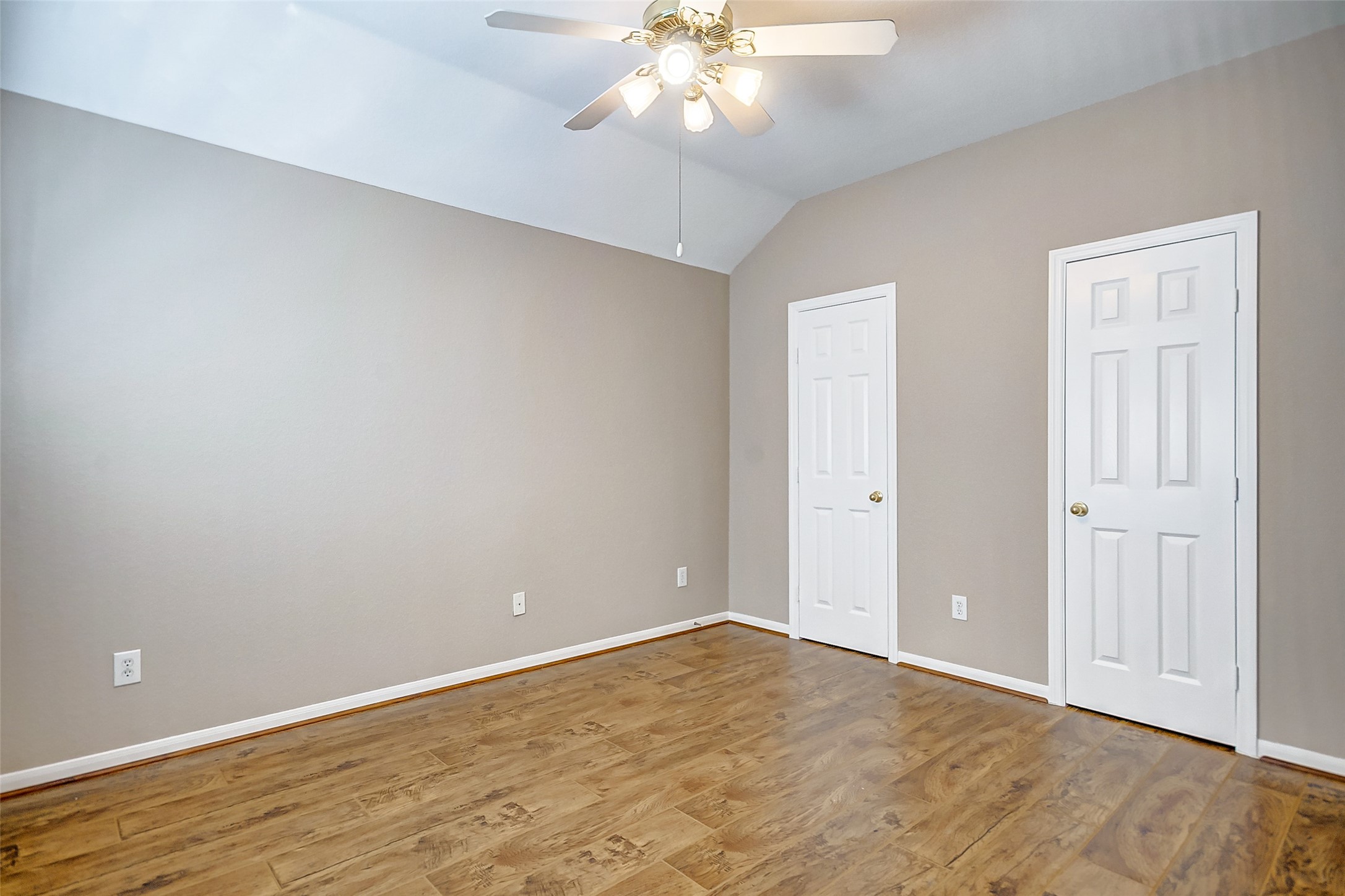 2022 Ridge Wood Lane Sugar Land, TX 77479 - Photo 13 of 21 a view of an empty room with wooden floor