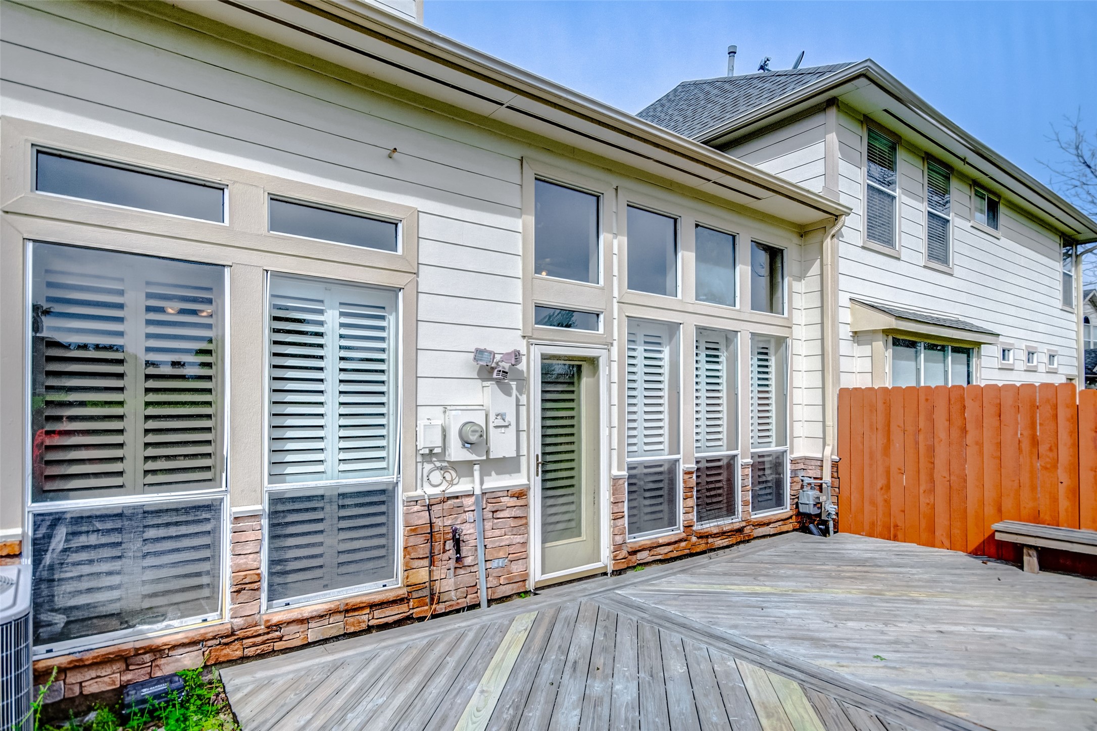 2022 Ridge Wood Lane Sugar Land, TX 77479 - Photo 17 of 21 a view of backyard with a door and wooden floor