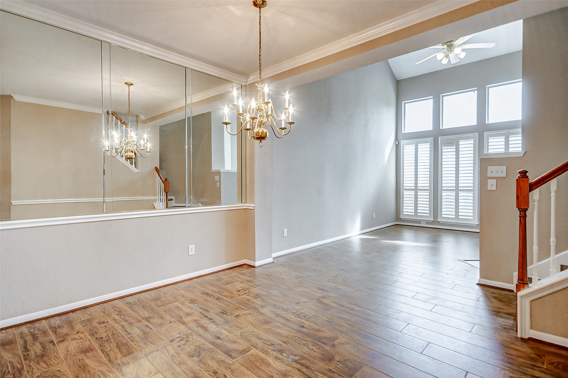 2022 Ridge Wood Lane Sugar Land, TX 77479 - Photo 5 of 21 a view of a livingroom with a fireplace wooden floor and chandelier