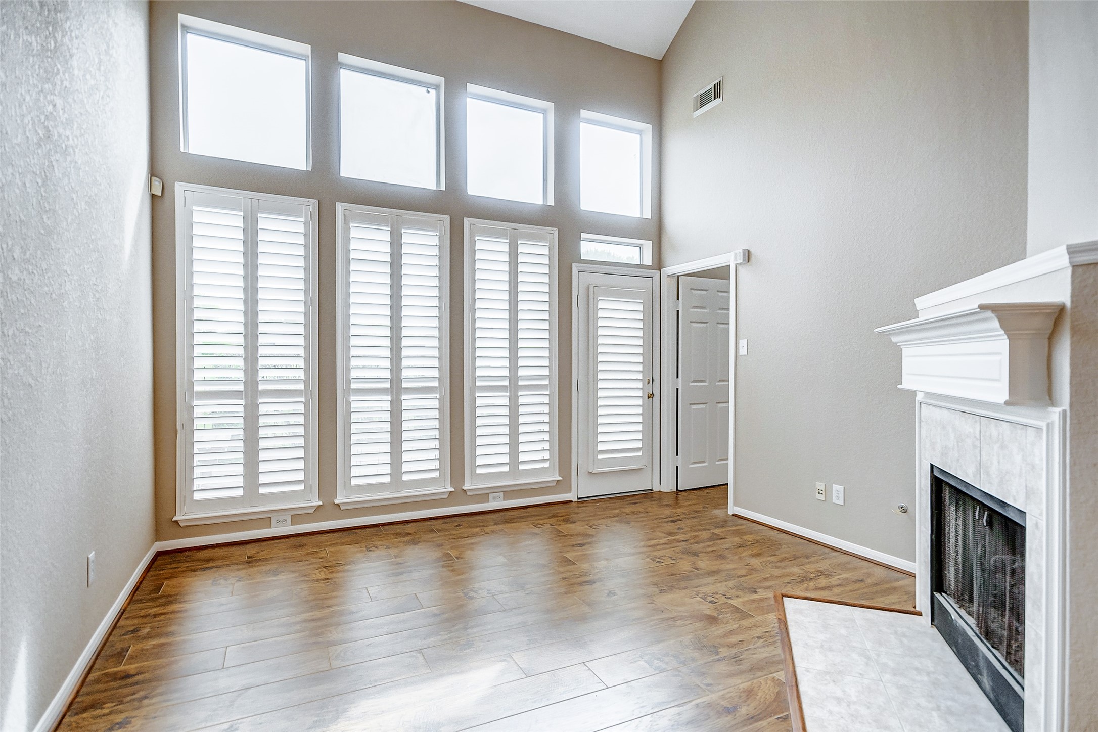 2022 Ridge Wood Lane Sugar Land, TX 77479 - Photo 6 of 21 a view of an empty room with wooden floor and a window