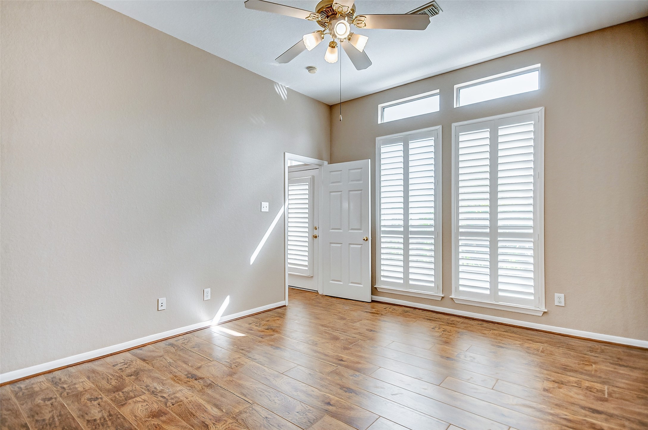 2022 Ridge Wood Lane Sugar Land, TX 77479 - Photo 8 of 21 wooden floor in an empty room with a window