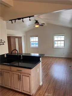 a kitchen with stainless steel appliances a refrigerator and a microwave