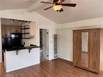 a kitchen with stainless steel appliances a refrigerator and a microwave