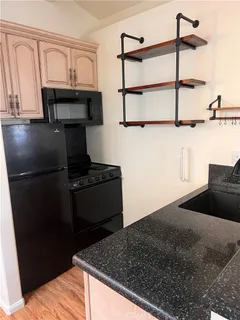 a view of a living room with wooden floor