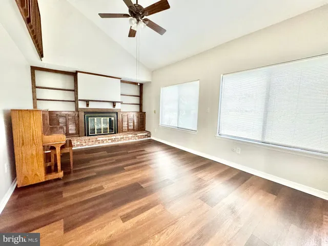 a view of livingroom with furniture wooden floor and window