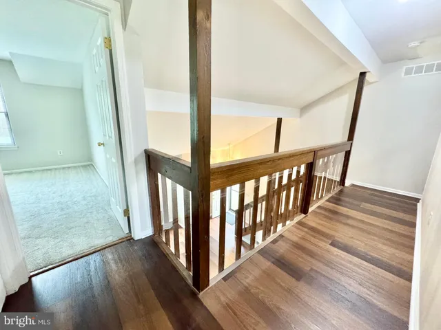 a view of an entryway with wooden floor