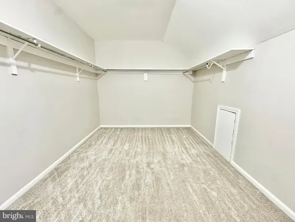 a view of a room with racks on the wall