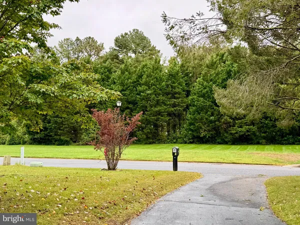a view of a swimming pool with a small yard