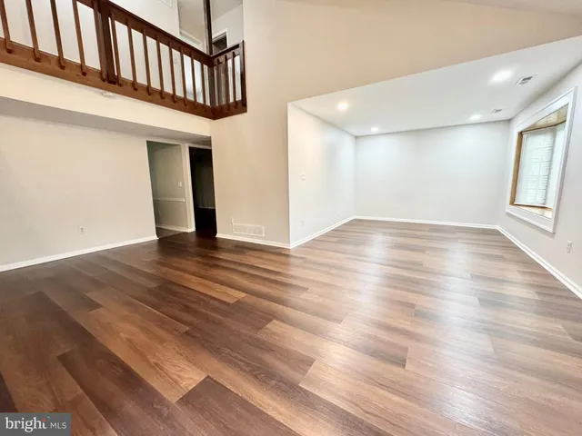 a view of an entryway with wooden floor