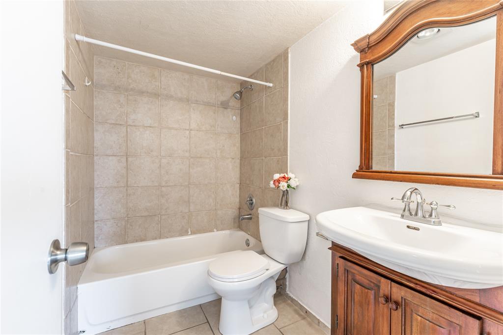 312 Southeast 10th Avenue, Unit C Pompano Beach, FL 33060 - Photo 18 of 23 a bathroom with a sink toilet and shower