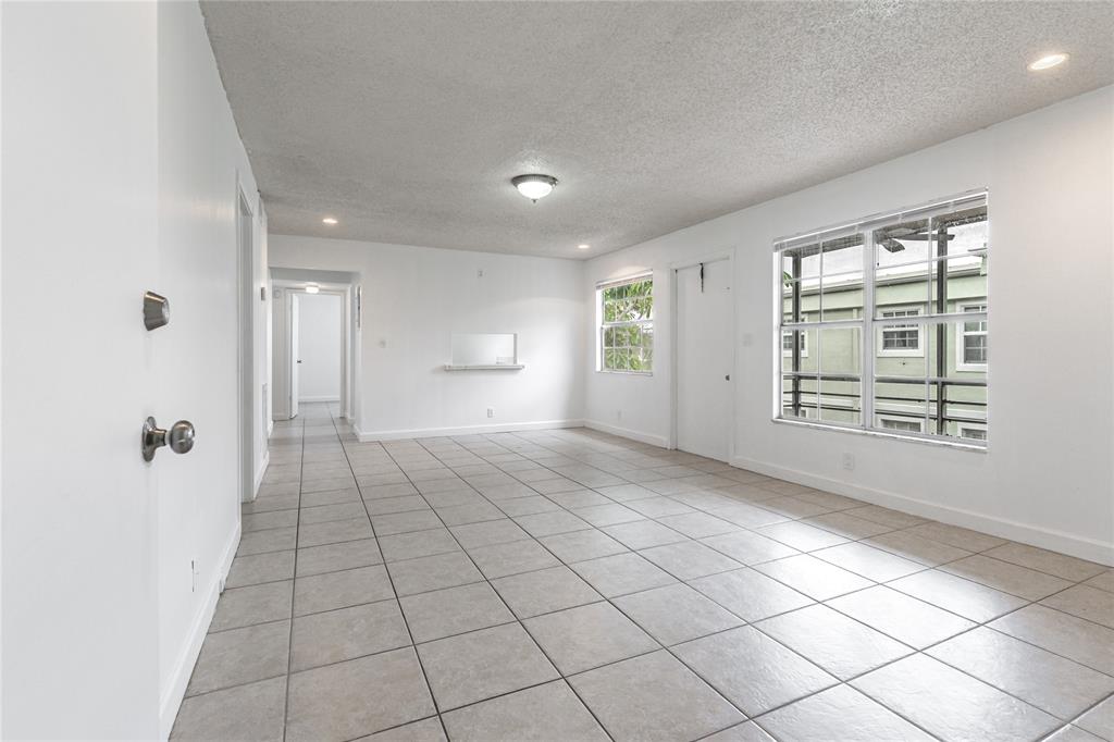 312 Southeast 10th Avenue, Unit C Pompano Beach, FL 33060 - Photo 5 of 23 a view of an empty room and window