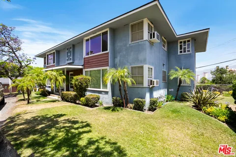 a view of multiple house with a patio