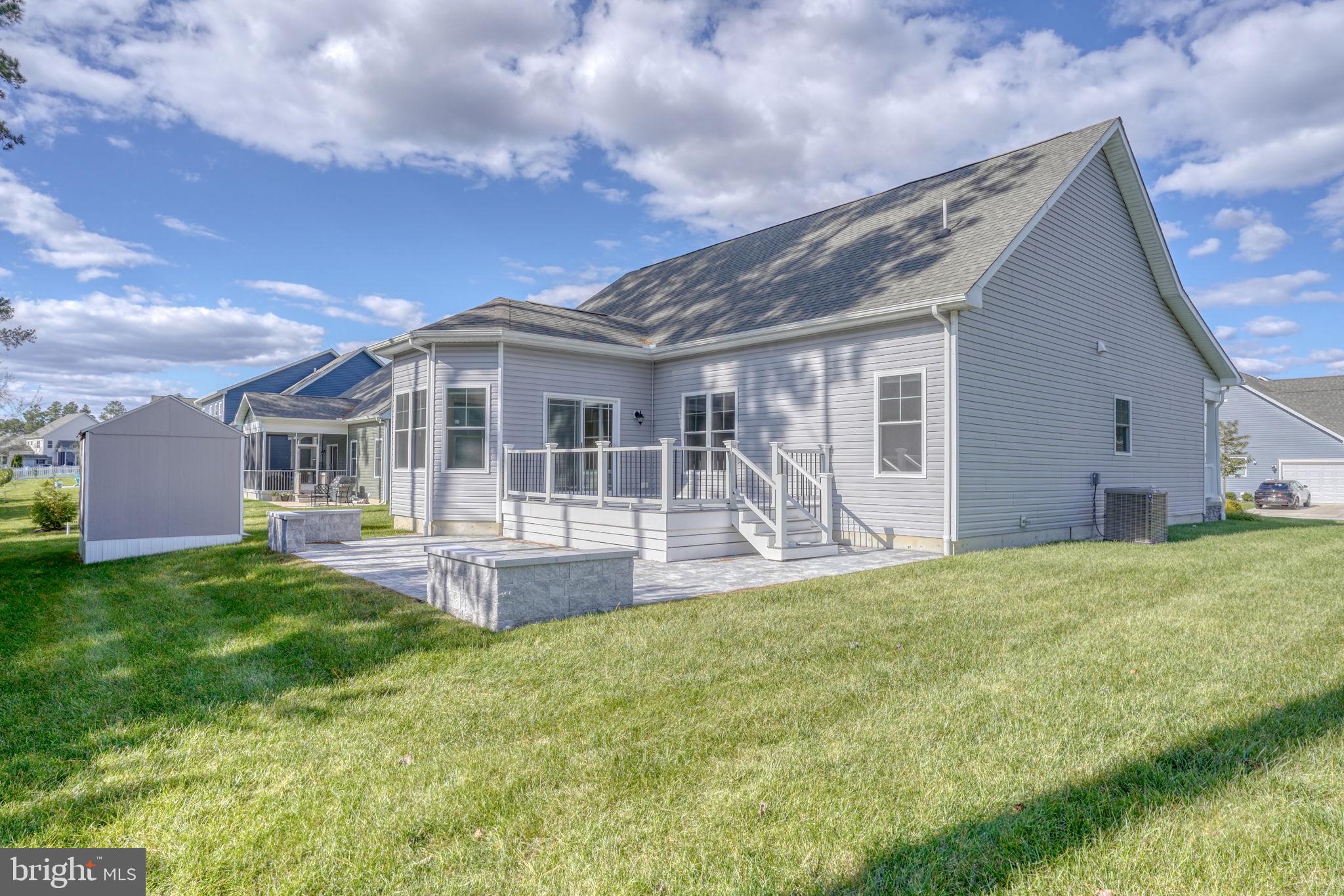 18822 Melville Way Georgetown, DE 19947 - Photo 13 of 24 a front view of a house with a yard and porch