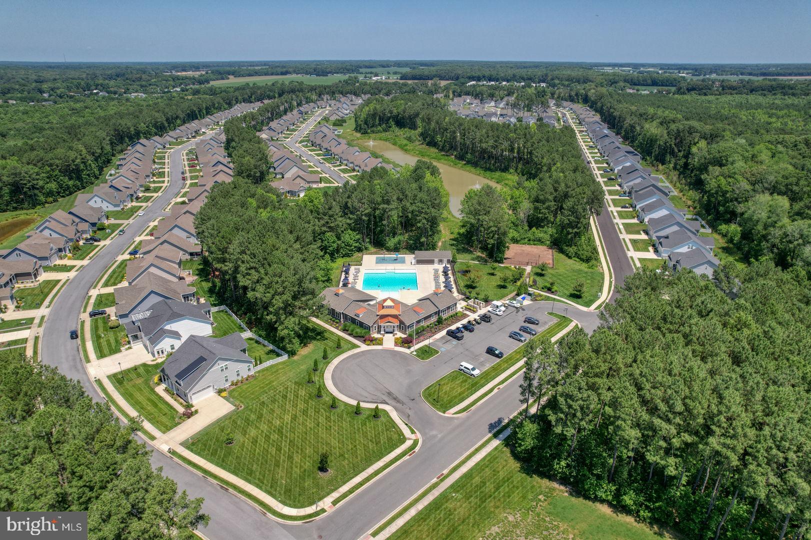 18822 Melville Way Georgetown, DE 19947 - Photo 21 of 24 an aerial view of a house with garden space and street view