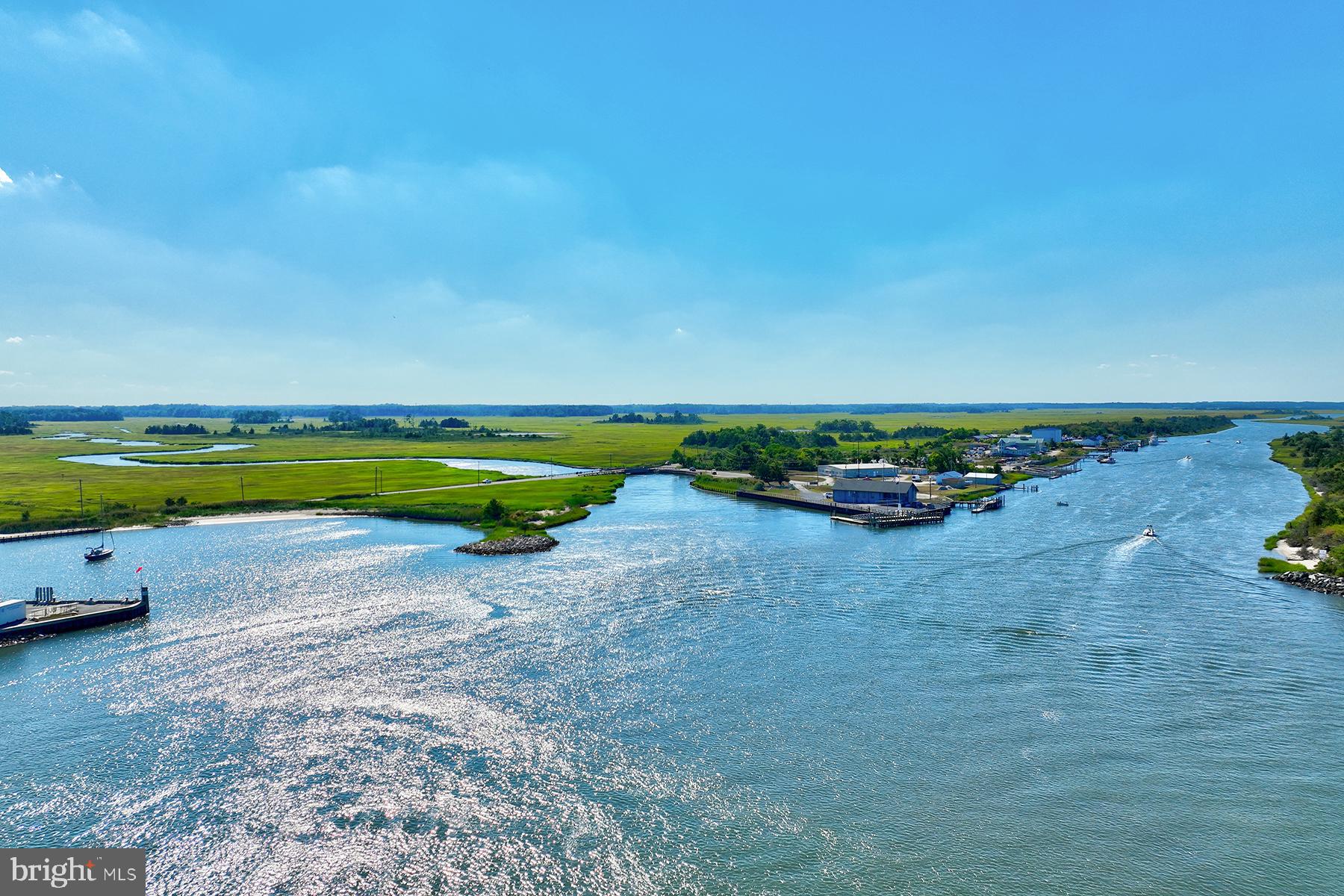 18822 Melville Way Georgetown, DE 19947 - Photo 24 of 24 a view of a lake with a beach