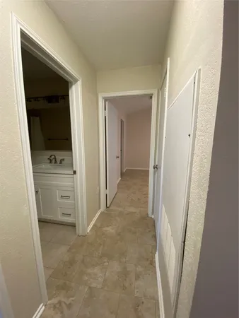 a view of hallway with washer and dryer