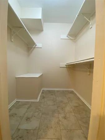 a bathroom with a double vanity sink toilet mirror and shower