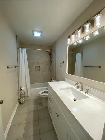 a bathroom with a shower and a bathtub