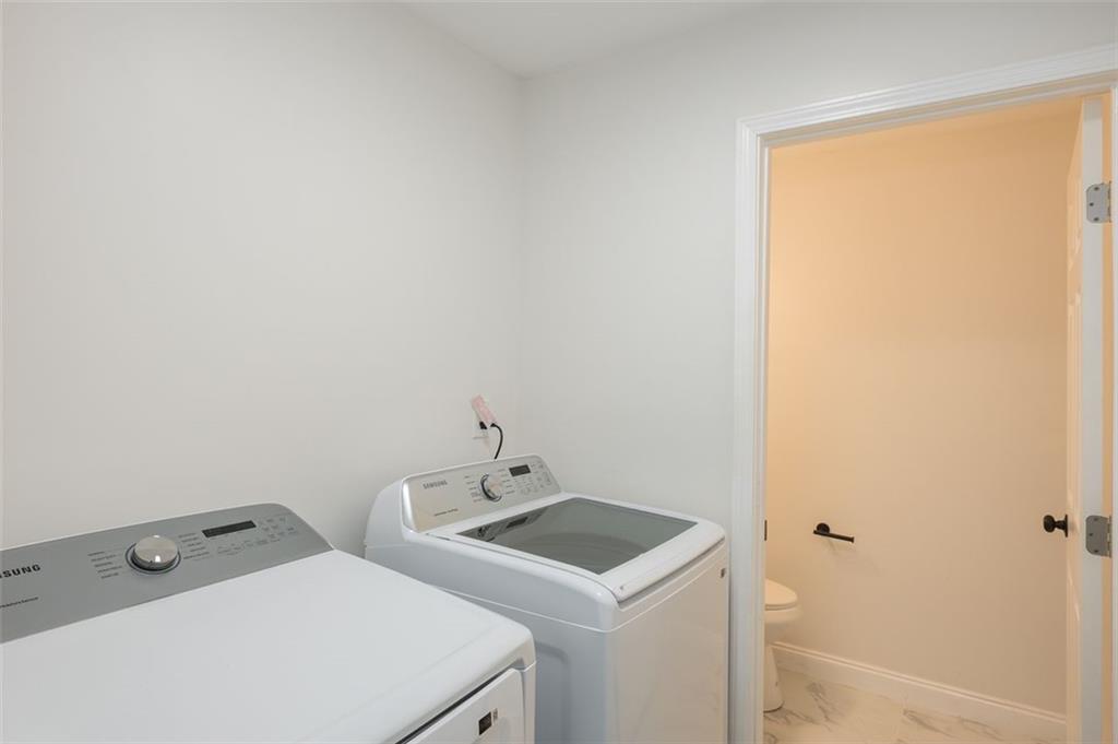 2027 Lois Place Northwest, Unit A Atlanta, GA 30318 - Photo 11 of 23 a utility room with dryer and washer