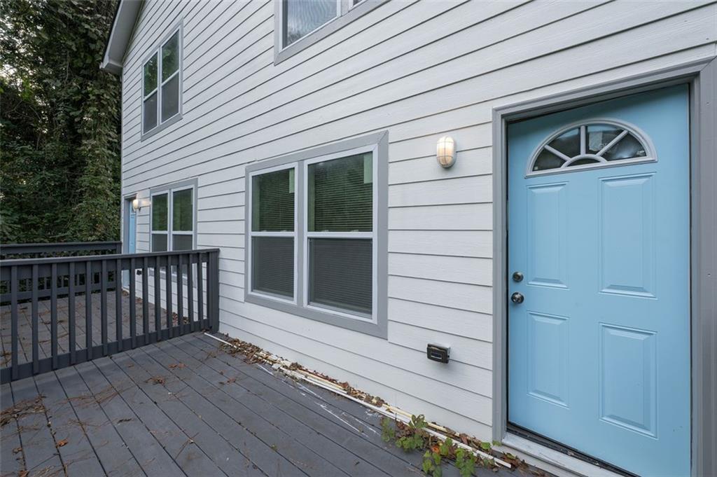 2027 Lois Place Northwest, Unit A Atlanta, GA 30318 - Photo 13 of 23 a view of a house with a door and wooden floor